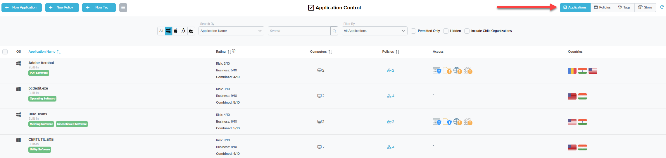 Application Control list view: rows for Adobe Acrobat, bcdedit.exe, Blue Jeans, CERTUTIL.EXE with OS, application name, type (Built-In), category tags, risk and business ratings, computer counts, policy counts, access icons, and country flags